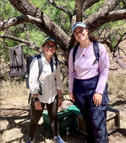 Image of two students, including Haley Planicka, at field site along the Arizona-Mexico border